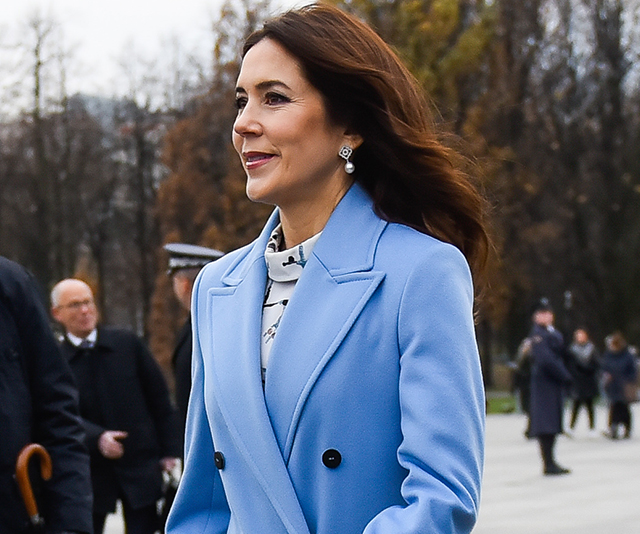 Crown Princess Mary wears a trench coat with a colourful twist as she steps out in Poland