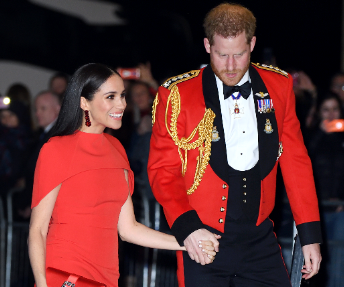 Meghan & Harry opt for matching siren-red ensembles as they arrive at musical date night in London