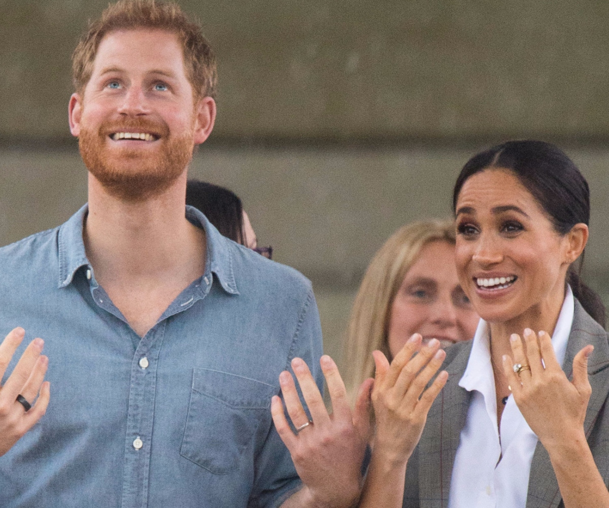 Prince Harry & Duchess Meghan have chosen one of their most iconic photos from Australia to share with fans