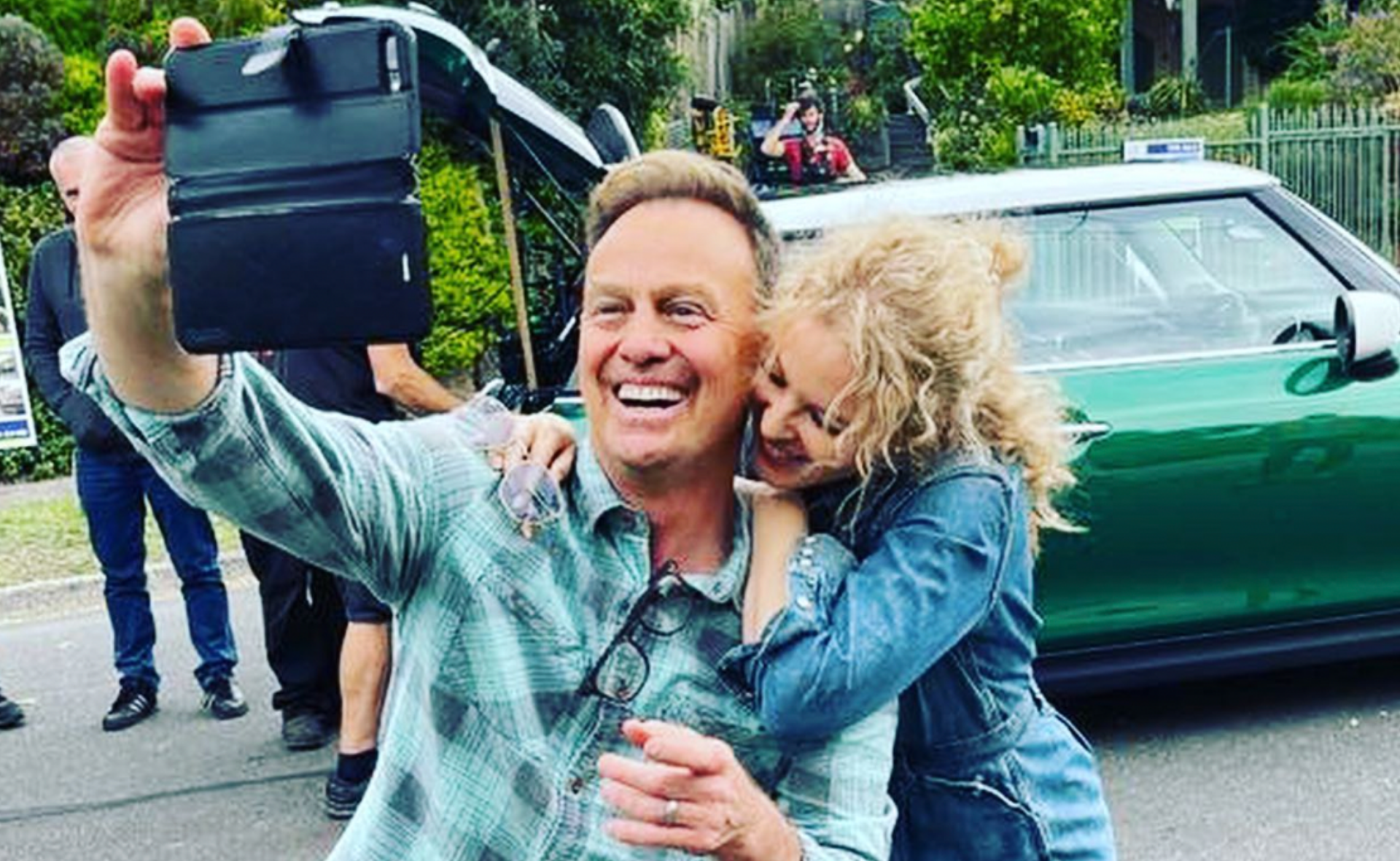 Back together! Kylie Minogue and Jason Donovan share new and adorable snaps from the Neighbours set