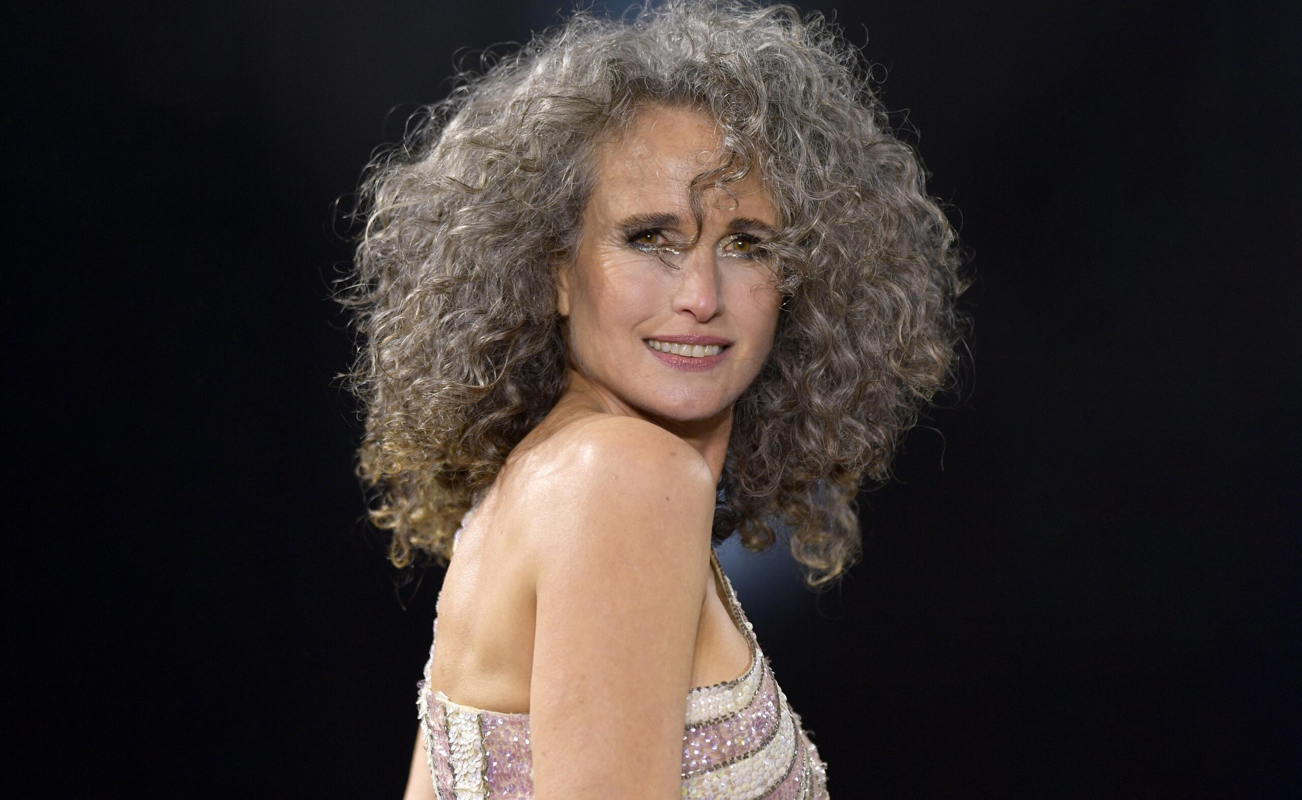 How going grey won Andie MacDowell, 64, a spot at one of the most famous fashion events in the world