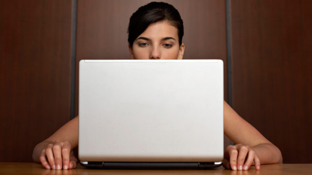Woman secretively checking emails