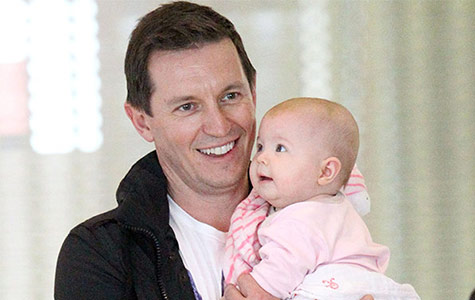 Rove McManus arrives in Sydney with his baby girl