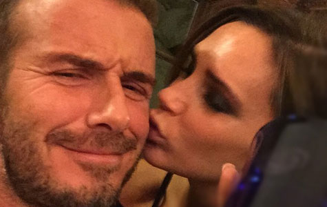 Victoria smooches David Beckham as he launches his own whisky line
