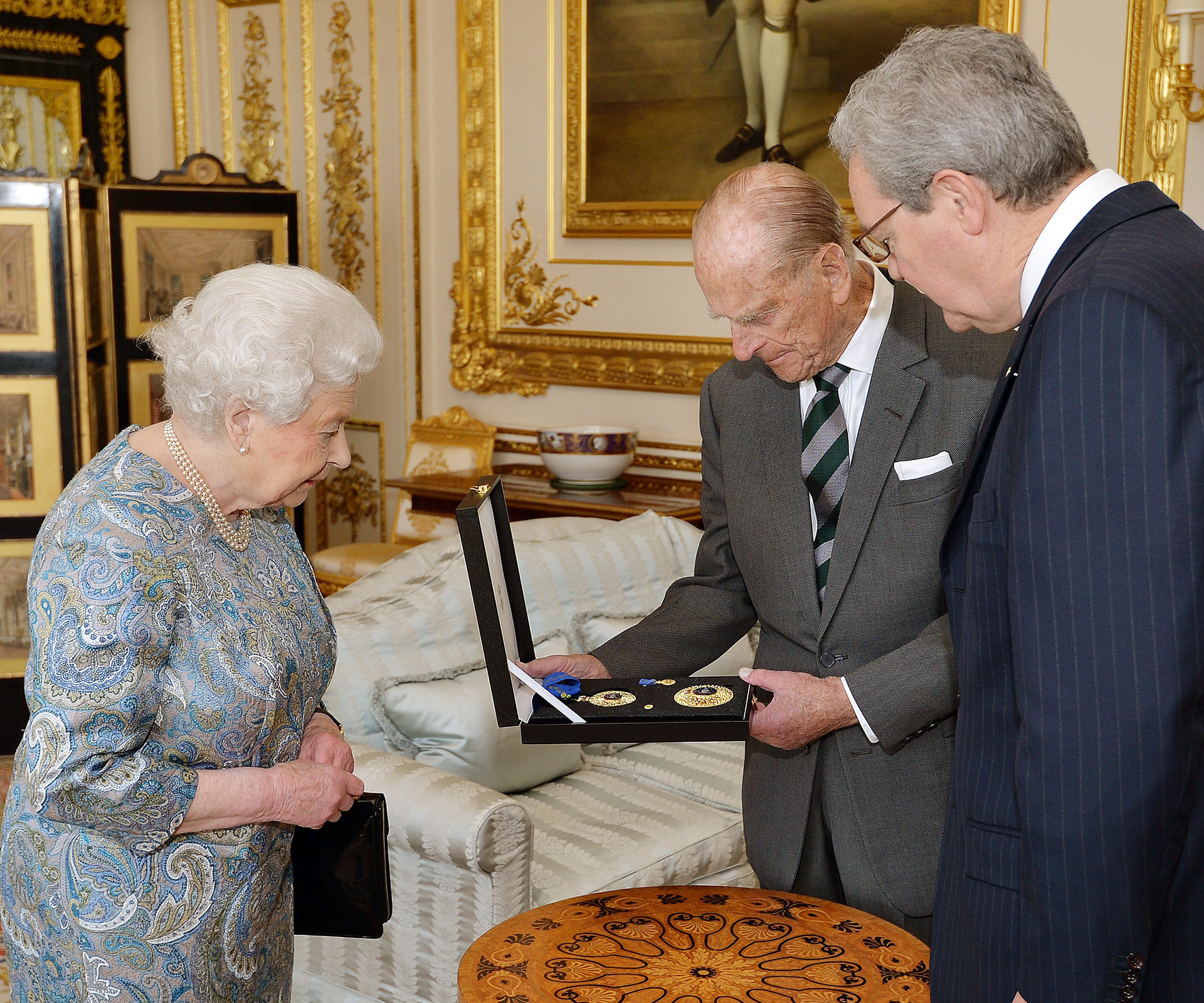 Queen Elizabeth presents Prince Philip with Australian knighthood