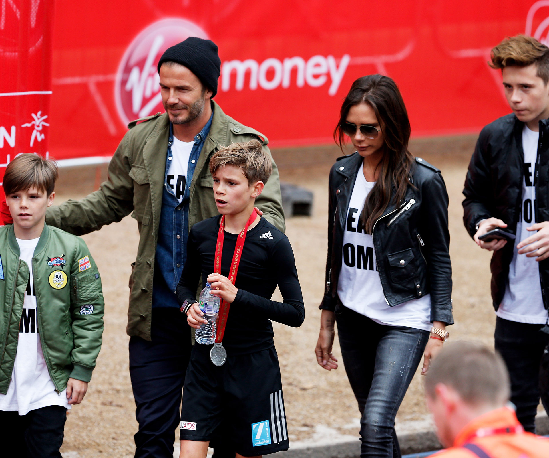 The Beckhams cheer on Romeo as he runs the London marathon