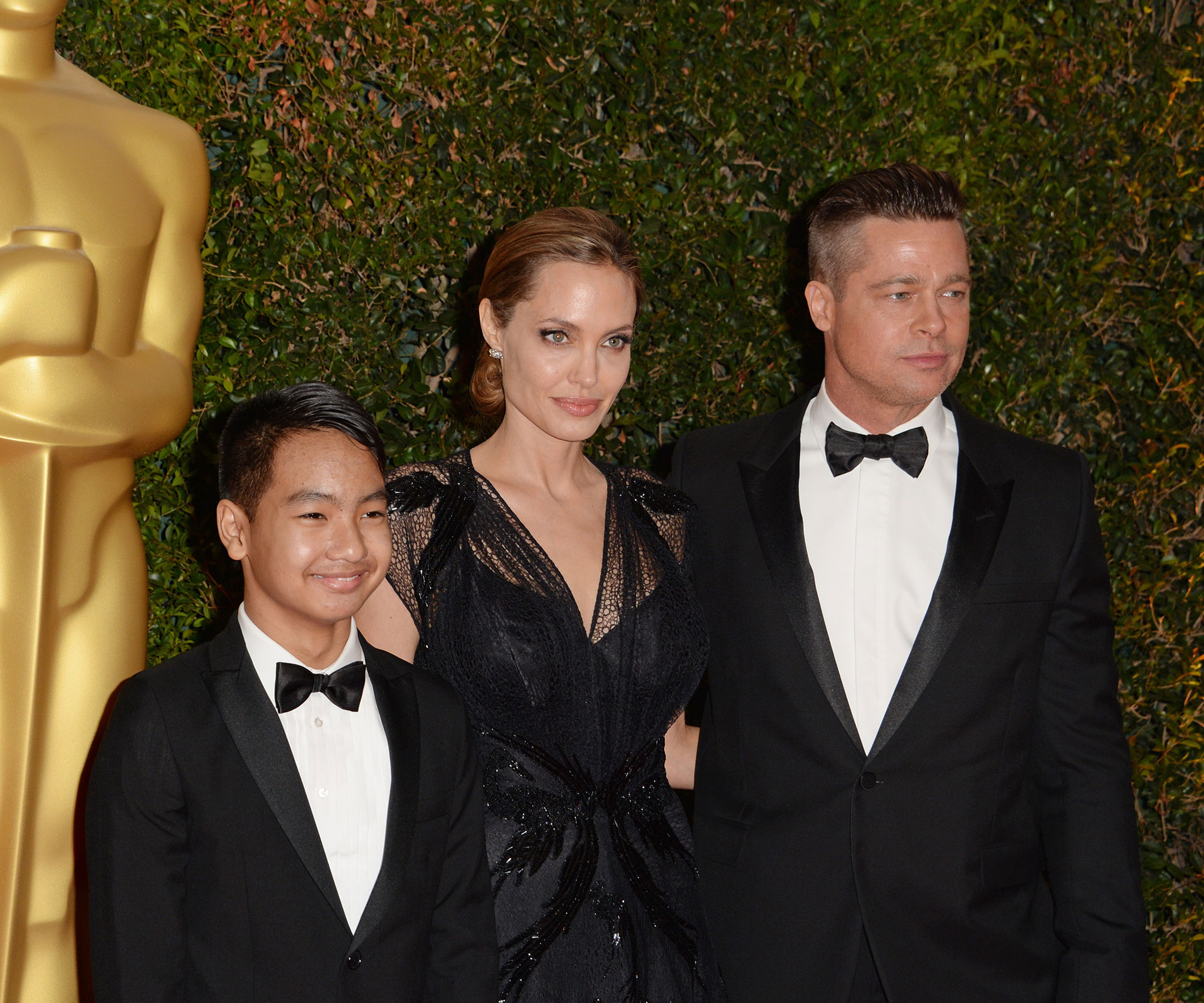 Angelina Jolie, Maddox Jolie-Pitt and Brad Pitt