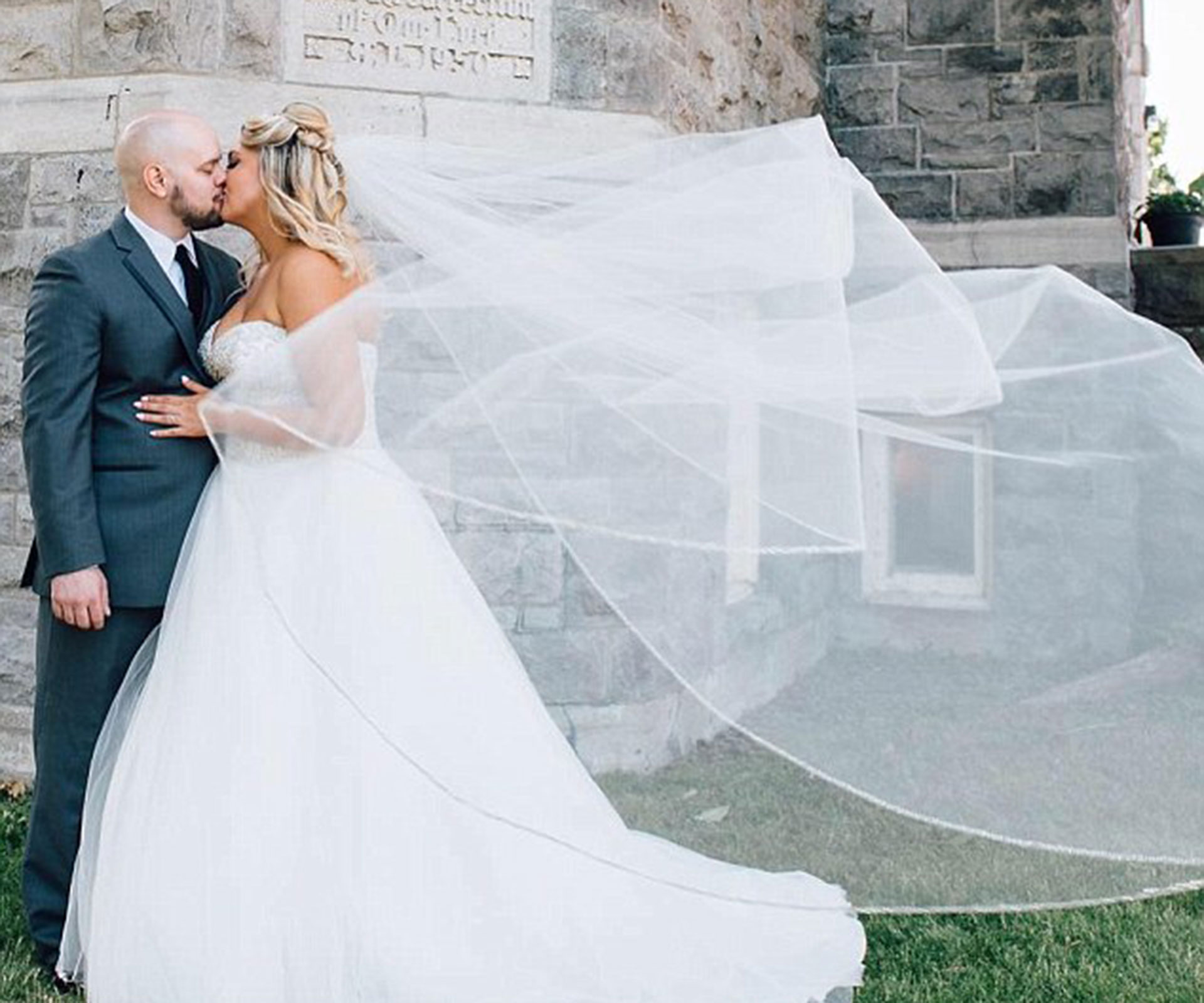 Bride breastfeeds during wedding ceremony